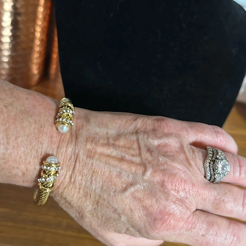 - Sophisticated Gold Bracelet. Titanium with pear colored stones & clear stone